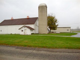 Country home with asphalt drive on nearly 12 acres with woods and outbuildings.  1-1/2 Story remodeled farm home with 3 bedrooms, 2 baths, eat-in kitchen w/custom hickory cabinets (J. Miller) and all appliances including washer and dryer.

Spacious living/dining room, full concrete block basement, covered front porch, rear deck and extra deep 2-car garage.

Quiet location convenient to town. - Country Home on 3.5 Acres